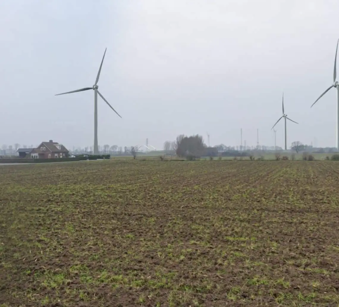 Smart Energy Hub Zutphen combining wind turbines and battery storage connected to a shared grid infrastructure.
