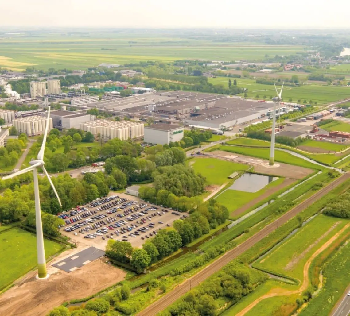 Wind turbines at Windpark Barrepolder supplying renewable energy directly to Heineken Zoeterwoude brewery for industrial sustainability.